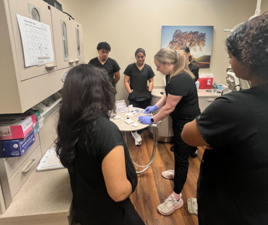 Houston Dental Assistant School students observing their instructor
